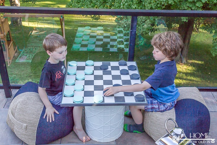 children playing checkers outside