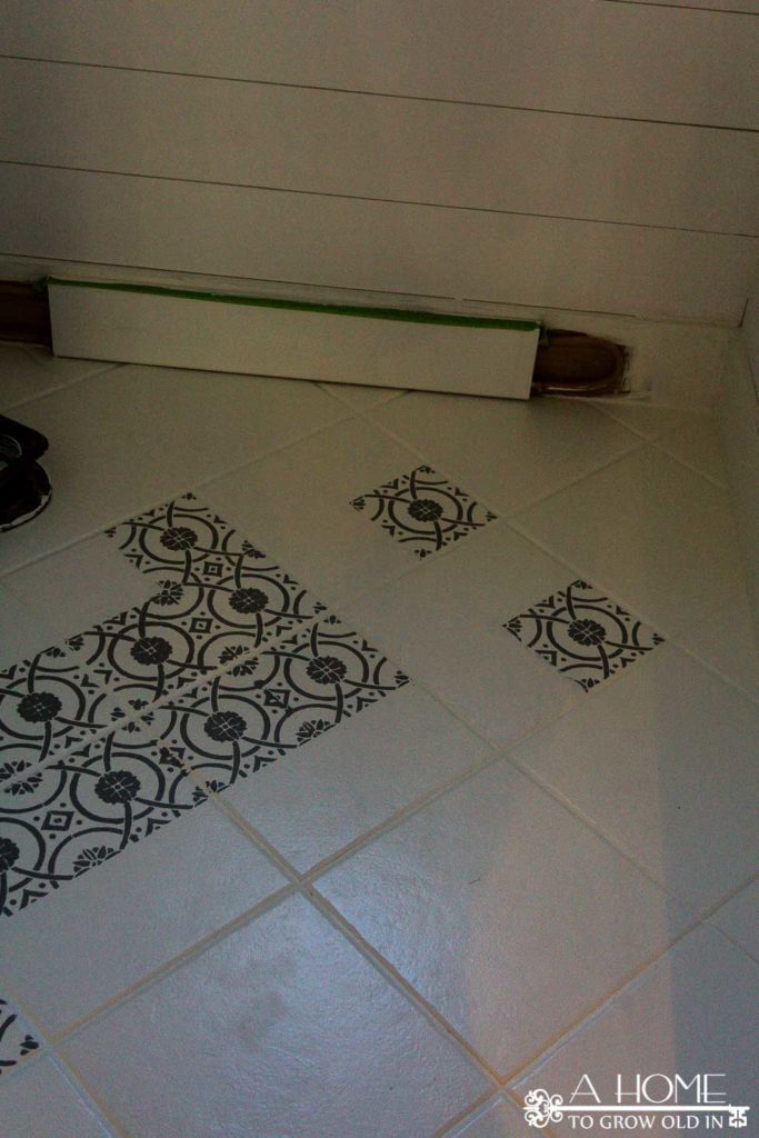Do you love the bold patterns of cement tiles? Learn how to turn your tile floor into beautiful faux cement tiles that look just like the real thing! It's an easier DIY than you think!