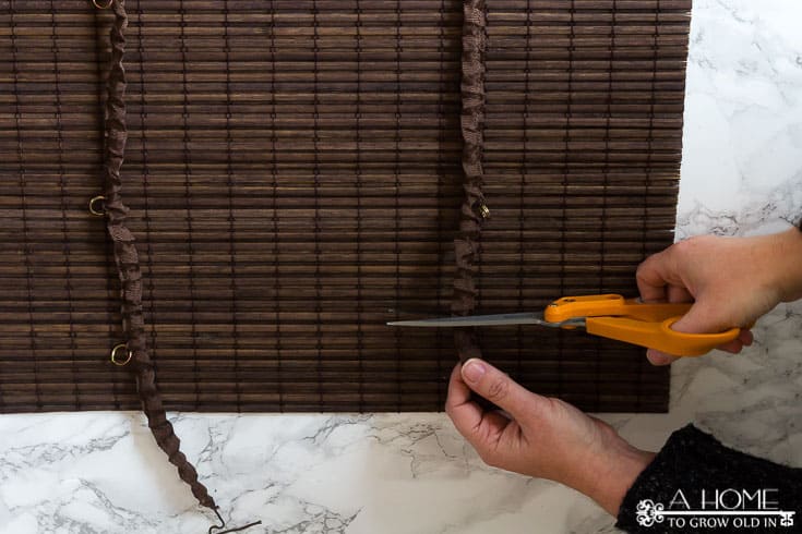 This is a great tutorial on where to buy inexpensive bamboo shades for any size window and how to easily shorten them to get a custom made look. Pin it so you don't forget it!