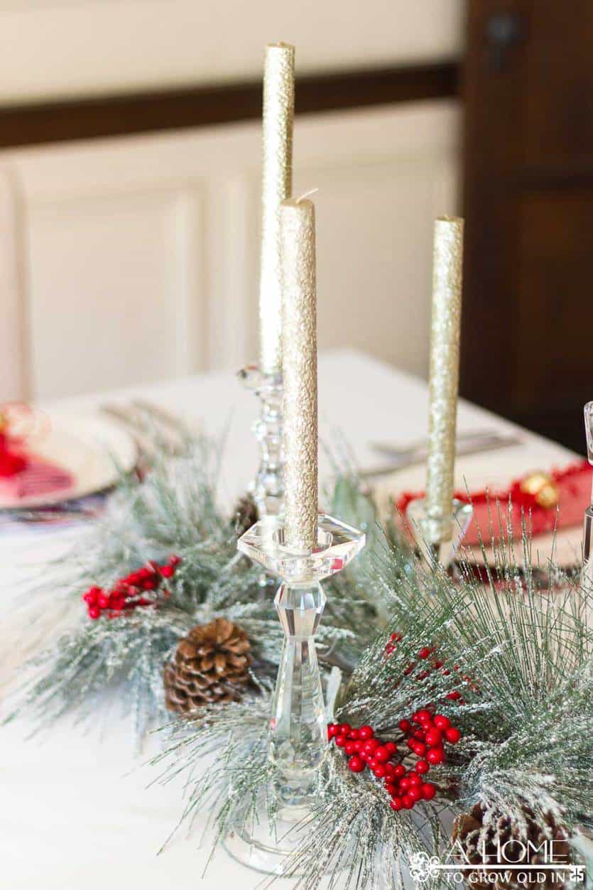 This simple and elegant Christmas tablescape has lots of fun ideas like DIY red and white plaid placemats, fringed napkins, and a beautiful snowy centerpiece. #christmastablescape #christmas
