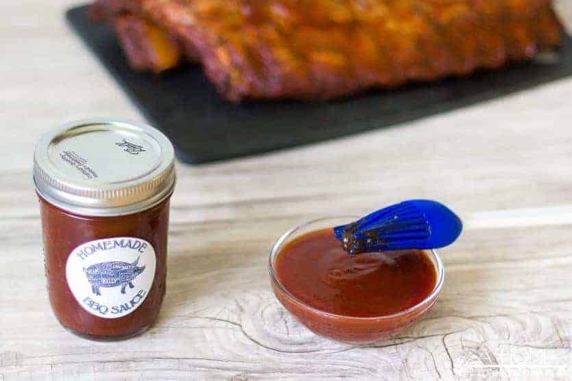An easy sweet and spicy homemade BBQ sauce recipe that works well with all beef, pork, and chicken. You'll also want to print out these cute labels for your jars. These jars would make a great Father's Day gift!