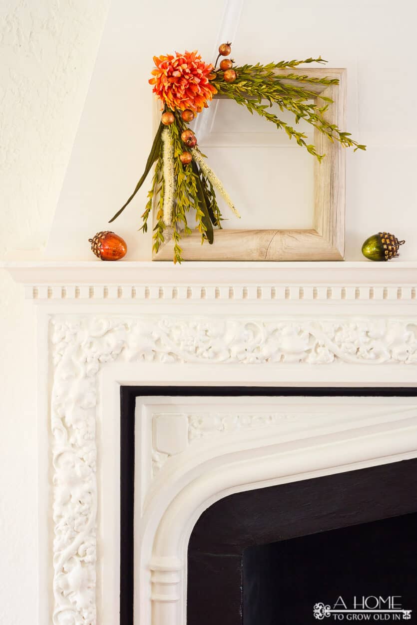 square fall pool noodle wreath on a fireplace mantel