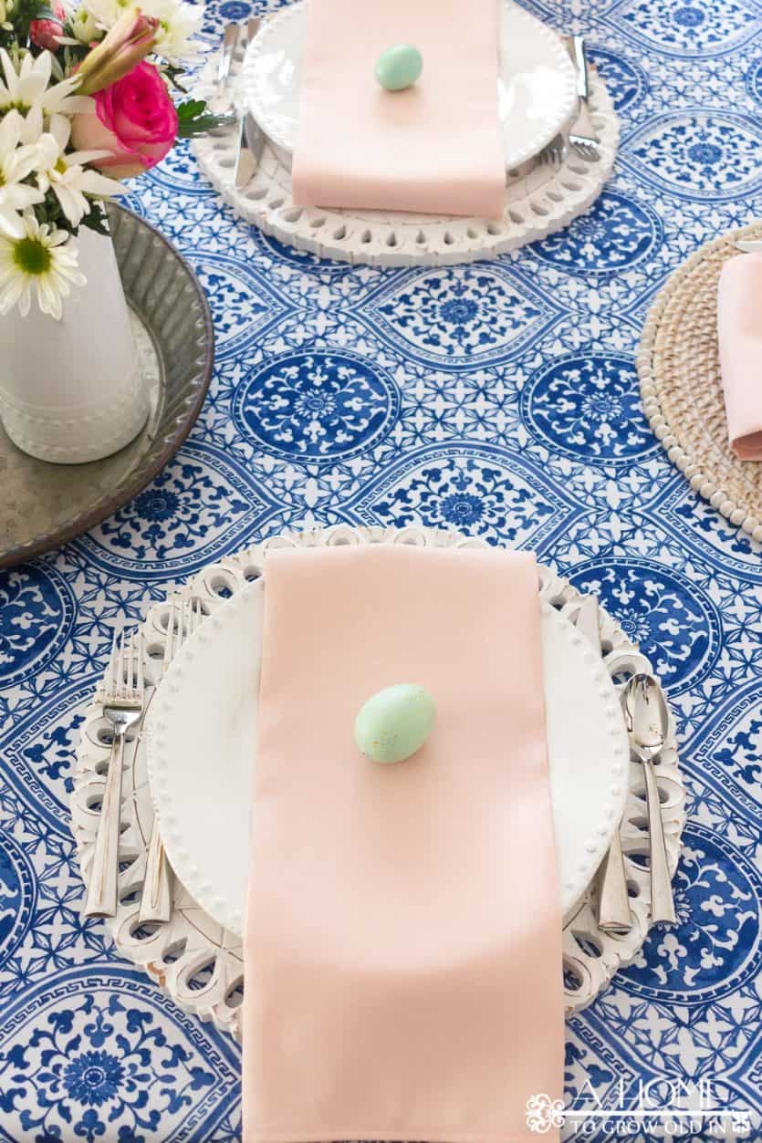 This cobalt blue and blush pink spring tablescape will give you lots of inspiration to get your dining room ready for your spring entertaining or Easter brunch. #spring #springdecor #diycrafts #easter #tablescape #springtablescape #easterdecor #eastertablescape #springdiningroom