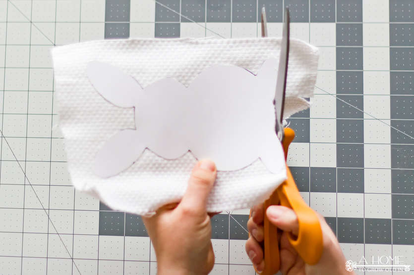 cutting a bunny from fabric using a paper template
