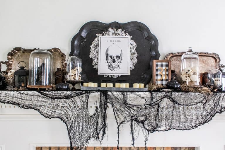 Spooky skull mantel with various Halloween home decor