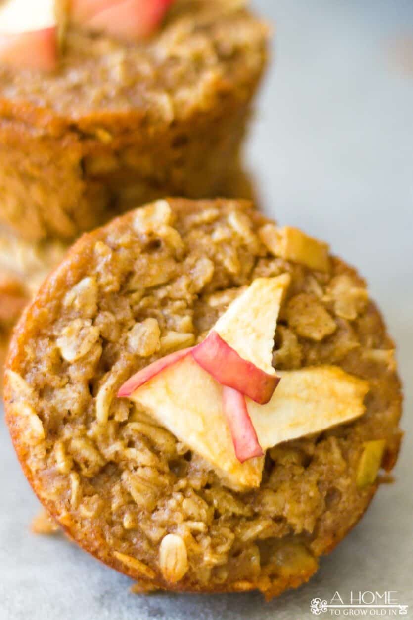 A close up of small apple pieces on top of cinnamon apple oatmeal muffins