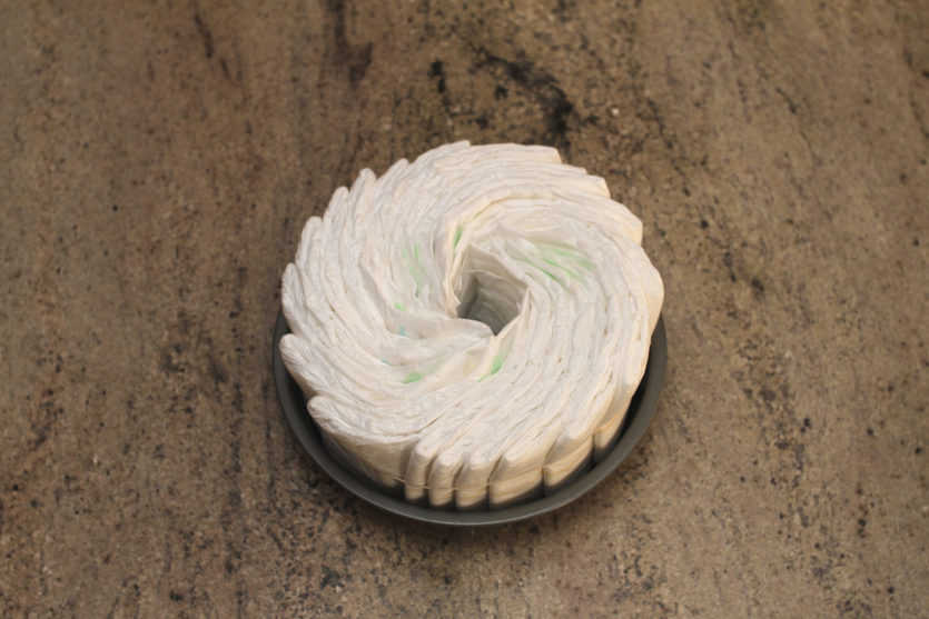 diapers fanned out in a cake pan