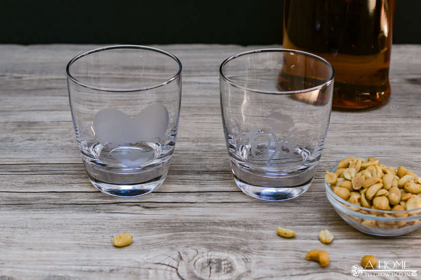 two whiskey tumblers with peanuts