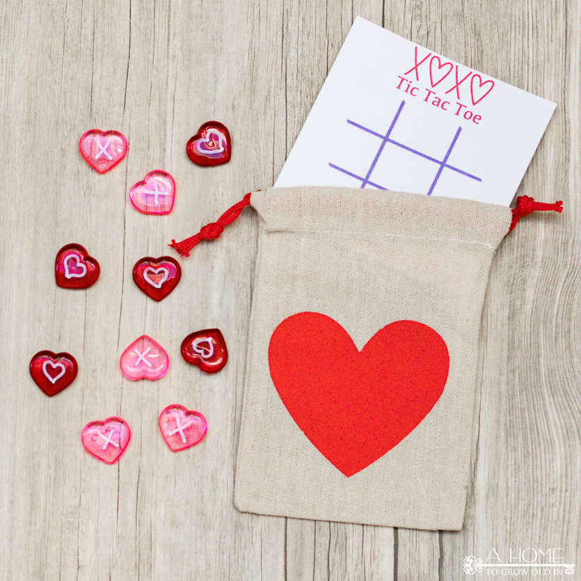 heart gift bags with a tic tac toe Valentine card and heart game pieces
