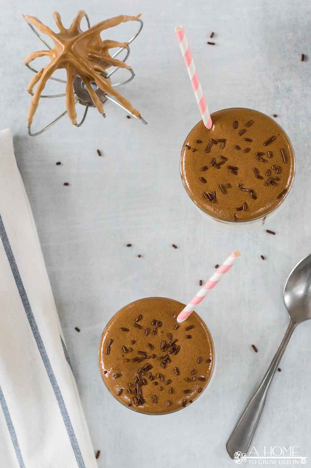 mocha dalgona whipped coffee recipe with chocolate sprinkles and a straw