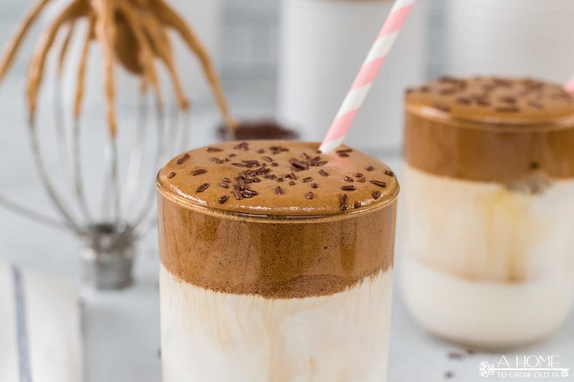 mocha dalgona whipped coffee recipe with chocolate sprinkles and a straw